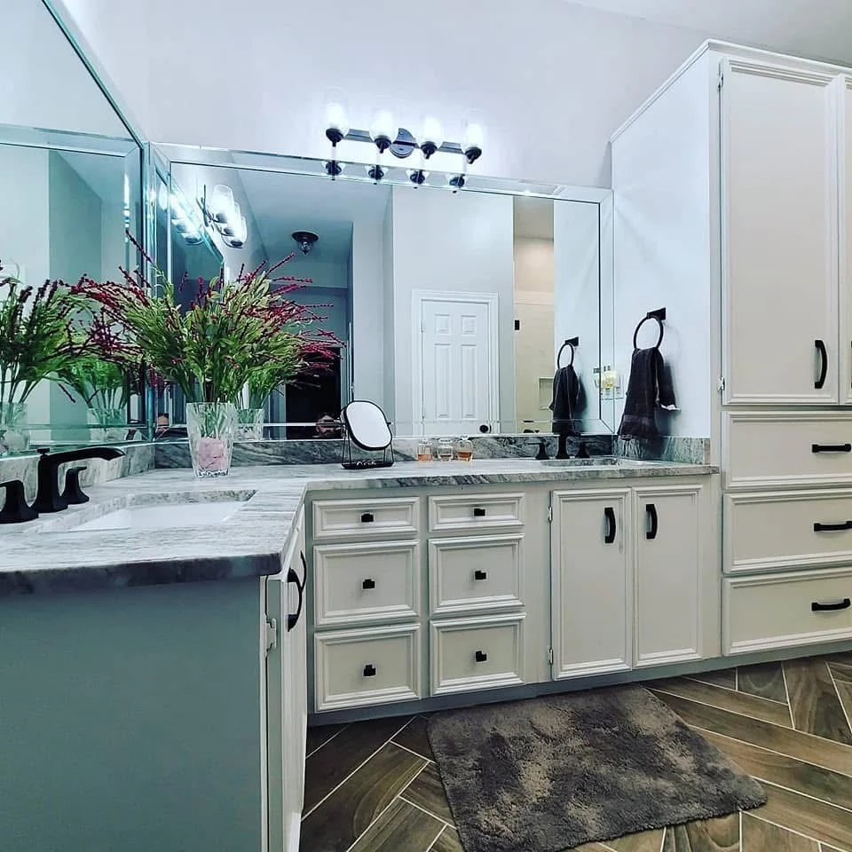 Luxury bathroom with dual vanity and framed mirror