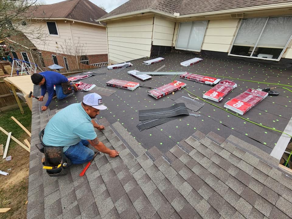 Roofing installation in progress with workers on site