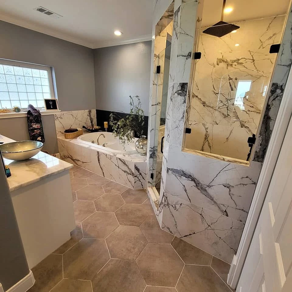 Bathroom remodel with glass shower enclosure and white tile