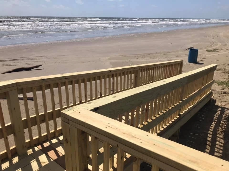 Coastal boardwalk overlooking sandy beach